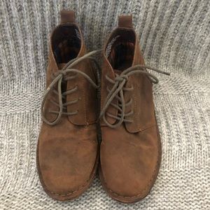 Brown leather lace up boots.